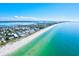 Aerial view of a community featuring a white sand beach and ocean at 6250 Holmes Blvd # 63, Holmes Beach, FL 34217