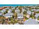 Beautiful aerial view of a beach neighborhood and single Gathering homes near the ocean at 6250 Holmes Blvd # 63, Holmes Beach, FL 34217