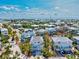 Stunning aerial view showcases homes with serene waterfront vistas and lush foliage at 6250 Holmes Blvd # 63, Holmes Beach, FL 34217