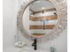 Bathroom featuring round mirror, updated vanity, and a modern walk-in shower at 6250 Holmes Blvd # 63, Holmes Beach, FL 34217