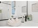 Bright bathroom vanity with unique seashell decor and modern black faucet at 6250 Holmes Blvd # 63, Holmes Beach, FL 34217
