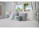 A close up of the plush pillows and soft bedding in the Primary bedroom at 6250 Holmes Blvd # 63, Holmes Beach, FL 34217
