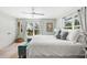 Bright bedroom featuring neutral tones, large windows, and stylish coastal accents at 6250 Holmes Blvd # 63, Holmes Beach, FL 34217