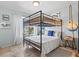 Charming bedroom with bunk beds, nautical decor, and lots of natural light at 6250 Holmes Blvd # 63, Holmes Beach, FL 34217