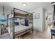 Charming bedroom with bunk beds, nautical decor, and easy bathroom access at 6250 Holmes Blvd # 63, Holmes Beach, FL 34217