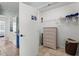 Walk-in closet featuring a wicker dresser, wire shelving, and convenient storage space at 6250 Holmes Blvd # 63, Holmes Beach, FL 34217