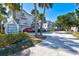 North Beach Village community featuring a street view of the townhomes and sign with lush landscaping at 6250 Holmes Blvd # 63, Holmes Beach, FL 34217