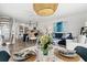 Open dining area with modern decor and a view of the living area and modern kitchen at 6250 Holmes Blvd # 63, Holmes Beach, FL 34217