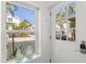 Bright entryway with a view of the neighborhood through a window and front door at 6250 Holmes Blvd # 63, Holmes Beach, FL 34217