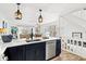 Kitchen island featuring stainless steel appliances, quartz countertops and decor at 6250 Holmes Blvd # 63, Holmes Beach, FL 34217