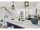 Kitchen featuring decorative pendant lighting, spacious countertops, and decor at 6250 Holmes Blvd # 63, Holmes Beach, FL 34217