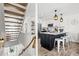 Modern kitchen featuring a center island with seating, pendant lights, and stainless steel appliances at 6250 Holmes Blvd # 63, Holmes Beach, FL 34217