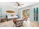 Bright living room with coastal decor, sliding glass doors, and stylish furnishings at 6250 Holmes Blvd # 63, Holmes Beach, FL 34217