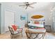 Cozy living room with coastal decor, comfortable seating, and a mounted television at 6250 Holmes Blvd # 63, Holmes Beach, FL 34217