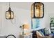 Bright living room featuring decorative pendant lighting and views of the living space at 6250 Holmes Blvd # 63, Holmes Beach, FL 34217