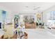 Bright living room and dining area featuring neutral decor and plenty of natural light at 6250 Holmes Blvd # 63, Holmes Beach, FL 34217
