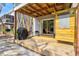 An outdoor shower provides a convenient rinse after beach visits, near a deck and sliding glass door at 6250 Holmes Blvd # 63, Holmes Beach, FL 34217