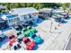 Variety of rental vehicles, including golf carts and fun cars, available at a rental shop with a white building at 6250 Holmes Blvd # 63, Holmes Beach, FL 34217