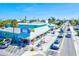 Brightly colored restaurant featuring outdoor seating, blue trim, and a festive atmosphere on a sunny day at 6250 Holmes Blvd # 63, Holmes Beach, FL 34217