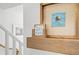 Coastal decor on wooden shelf featuring beach themed art and 'Happy Place' sign at 6250 Holmes Blvd # 63, Holmes Beach, FL 34217