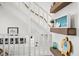Rope staircase featuring decor and natural wood floating shelves at 6250 Holmes Blvd # 63, Holmes Beach, FL 34217