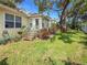 Charming home featuring a lush backyard with a large tree providing ample shade at 6402 23Rd Avenue W Dr, Bradenton, FL 34209