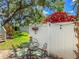 Inviting backyard patio featuring a glass table, chairs, privacy fence, and vibrant plants, perfect for outdoor gatherings at 6402 23Rd Avenue W Dr, Bradenton, FL 34209