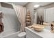 Neutral bathroom with a stone sink, elegant faucet, and decorative towel arrangement near the tub and shower at 6402 23Rd Avenue W Dr, Bradenton, FL 34209