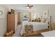 Inviting bedroom featuring a tropical theme, cozy bedding, and natural light at 6402 23Rd Avenue W Dr, Bradenton, FL 34209