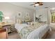 Comfortable bedroom featuring tropical-themed decor, cozy bedding, and ample sunlight at 6402 23Rd Avenue W Dr, Bradenton, FL 34209