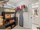 Organized closet with shelving, storage bins, and hanging space, with a bathroom visible through the door at 6402 23Rd Avenue W Dr, Bradenton, FL 34209