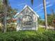 Capetown Village sign surrounded by well-maintained landscaping, welcoming residents to a private community at 6402 23Rd Avenue W Dr, Bradenton, FL 34209
