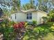 Charming home exterior showcasing well-maintained landscaping and a cozy, inviting setting at 6402 23Rd Avenue W Dr, Bradenton, FL 34209