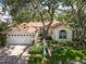Charming single-story home boasts lush landscaping, a brick driveway, and a welcoming two-car garage at 6402 23Rd Avenue W Dr, Bradenton, FL 34209
