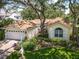 Charming single-story home with lush landscaping, attached garage, and a welcoming front lawn at 6402 23Rd Avenue W Dr, Bradenton, FL 34209
