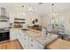 Well-lit kitchen with granite countertops, stainless steel appliances, and seamless flow to the dining area at 6402 23Rd Avenue W Dr, Bradenton, FL 34209