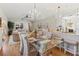 Open concept living and dining room featuring hardwood floors and an elegant chandelier at 6402 23Rd Avenue W Dr, Bradenton, FL 34209