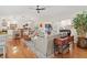 Open-concept living room featuring hardwood floors, stylish furnishings, and abundant natural light at 6402 23Rd Avenue W Dr, Bradenton, FL 34209