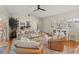 Comfortable living room featuring hardwood floors, plenty of natural light, and a ceiling fan at 6402 23Rd Avenue W Dr, Bradenton, FL 34209