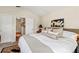Spacious main bedroom with a large bed, soft lighting, stylish rug, and doorway view at 6402 23Rd Avenue W Dr, Bradenton, FL 34209