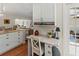 Office nook with built in cabinets, granite countertop, and view into the adjacent living area at 6402 23Rd Avenue W Dr, Bradenton, FL 34209