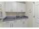 Butler's pantry features ample cabinetry, countertop space, and a beverage center at 6402 23Rd Avenue W Dr, Bradenton, FL 34209