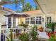 Inviting outdoor patio area with comfortable seating, decorative plants, and ample natural light at 6402 23Rd Avenue W Dr, Bradenton, FL 34209