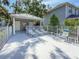 Relaxing pool area with lounge chairs, tables, and a covered cabana for shaded comfort at 6402 23Rd Avenue W Dr, Bradenton, FL 34209
