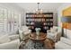Cozy sitting room with ample book storage, comfortable seating, and great natural light at 6402 23Rd Avenue W Dr, Bradenton, FL 34209