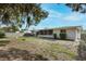 Backyard view with patio, fenced yard, and lush landscaping at 6442 Colonial Dr, Sarasota, FL 34231