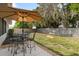 Spacious backyard featuring outdoor seating, cornhole game and patio at 6442 Colonial Dr, Sarasota, FL 34231