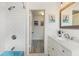 Classic bathroom features a blue tub, subway tile shower, and white vanity at 6442 Colonial Dr, Sarasota, FL 34231