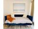 Comfortable daybed with plush cushions and a decorative throw blanket at 6442 Colonial Dr, Sarasota, FL 34231