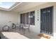 Cozy front porch with seating, a bike, and 'hello' doormat for a welcoming curb appeal at 6442 Colonial Dr, Sarasota, FL 34231